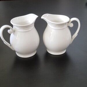 2 Pitchers Small With Lovely Raised Scroll Border Design